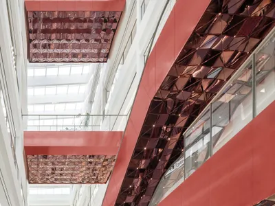 Ippolito Fleitz Group Treats a Wuxi Mall's Interior as an Urban Landscape in Coppery Red Metal