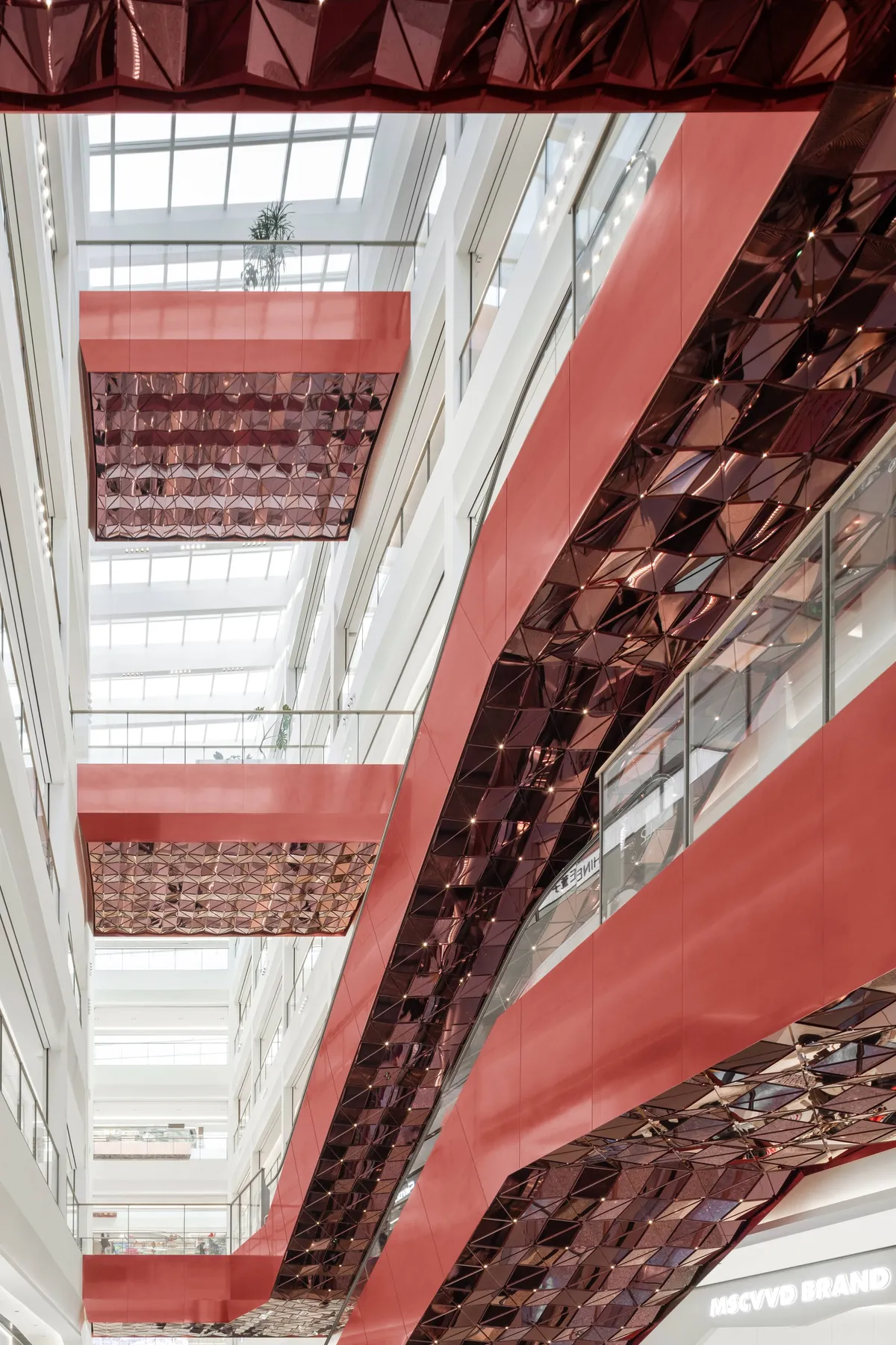 Ippolito Fleitz Group Treats a Wuxi Mall's Interior as an Urban Landscape in Coppery Red Metal