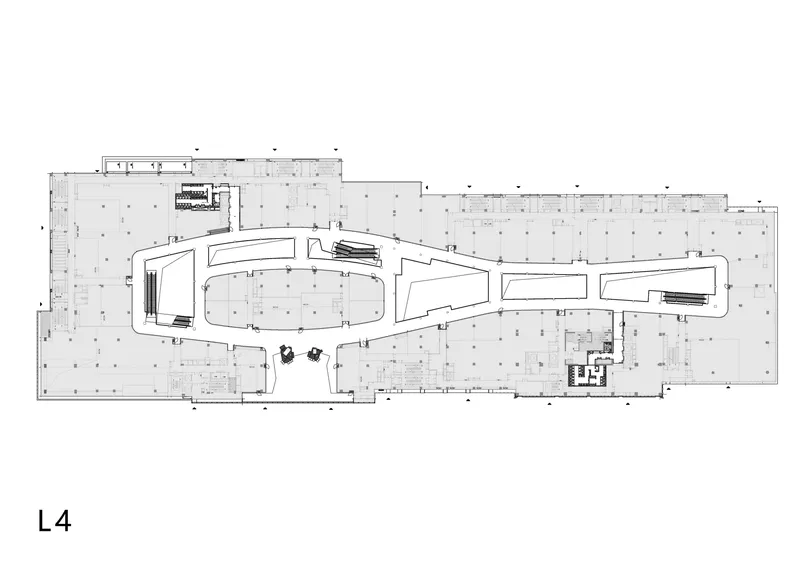 Floor plan drawing showing the same curvilinear volume with central vertical circulation elements