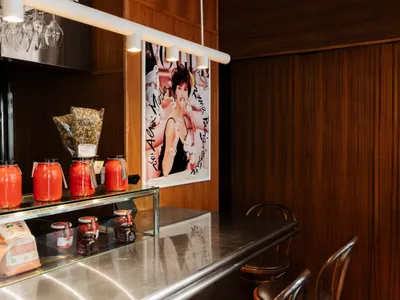 MRDK Turns a Montréal Magazine Store into a Stainless Steel Social Condenser