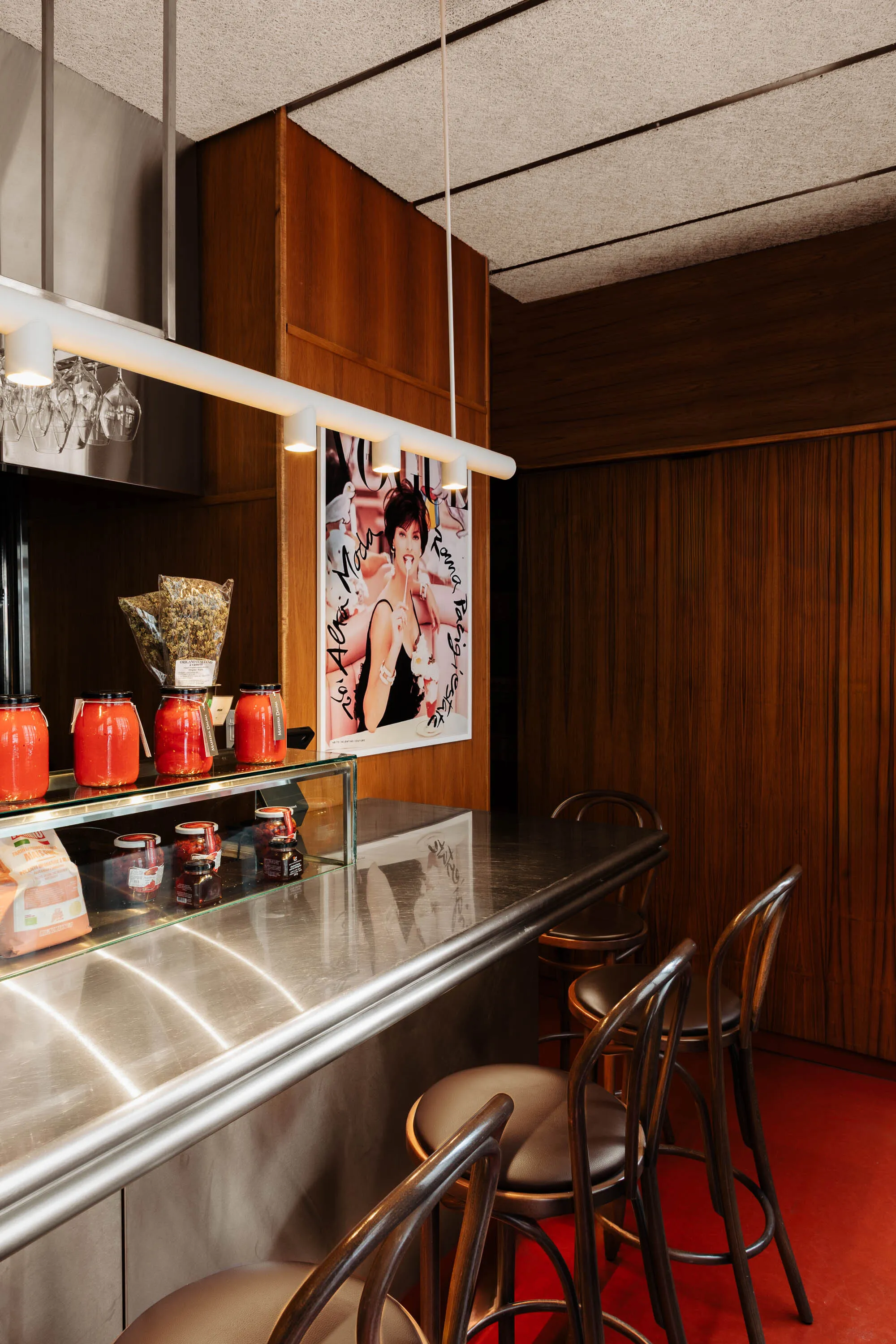 MRDK Turns a Montréal Magazine Store into a Stainless Steel Social Condenser
