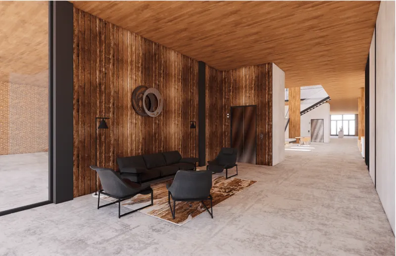 Warm timber lounge creating an intimate pause within the shared co-living interior.