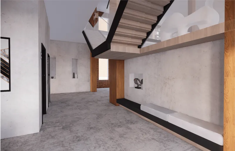 Compact seating nook beneath the staircase strengthens informal interaction and spatial continuity.