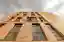 ASA Studio Stacks Offices and Apartments in a Naturally Ventilated Brick Tower Above Kigali's Rooftops