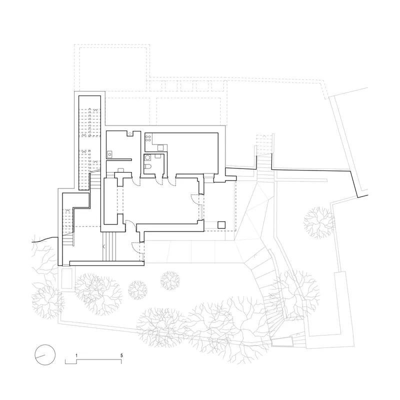 Ground floor plan drawing showing terraces stairs and interior rooms with surrounding landscape planting