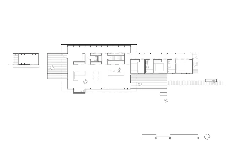 Floor plan drawing showing a linear arrangement of living spaces and bedrooms with deck extensions