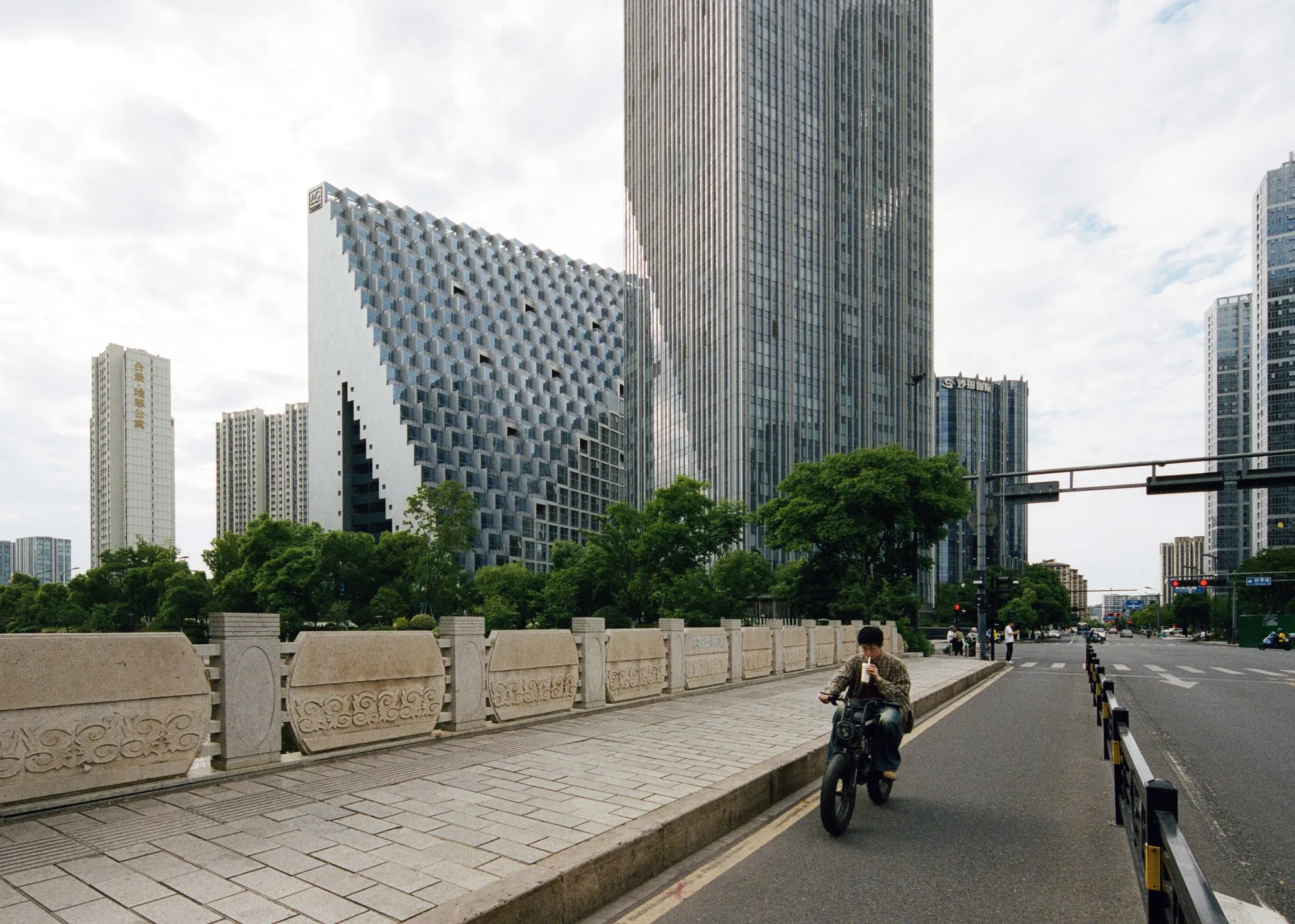 OMA Collapses a Cluster of Towers into One Prismatic Landmark in Hangzhou