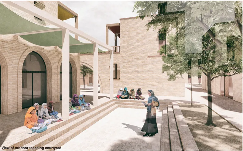 An outdoor teaching courtyard where architecture, landscape, and shared learning come together in an informal educational setting.