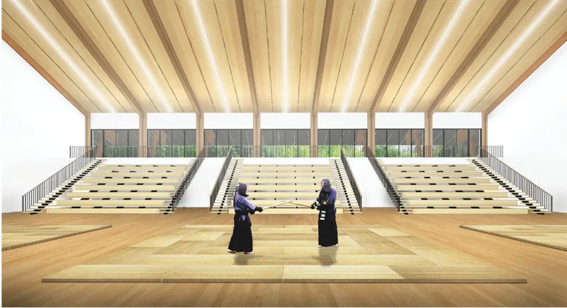 Multi-purpose dojo hall with timber ceiling, bleachers, and flexible martial arts practice zones.