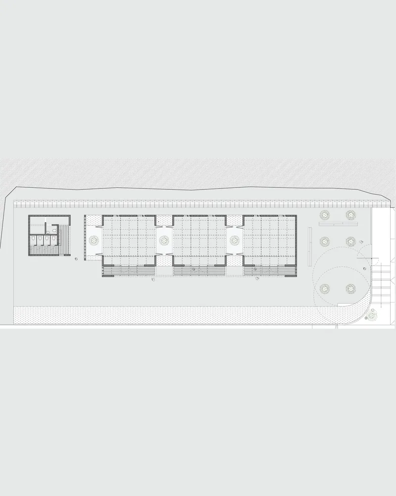 Floor plan showing three repeated bays with a courtyard at one end