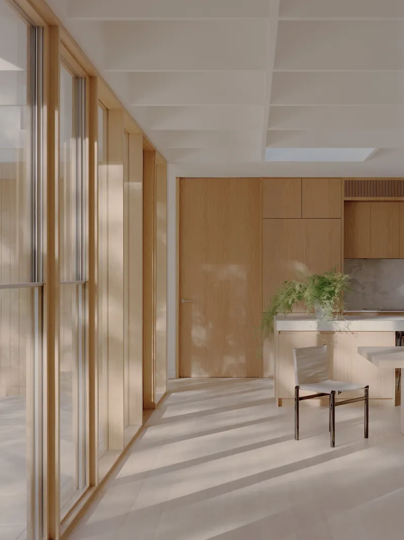 Interior hallway with timber-framed glass doors on the left and kitchen visible beyond
