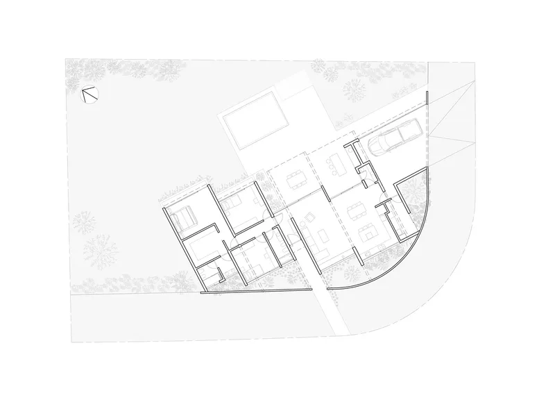 Floor plan drawing showing the angled layout of rooms with a curved exterior wall and pool