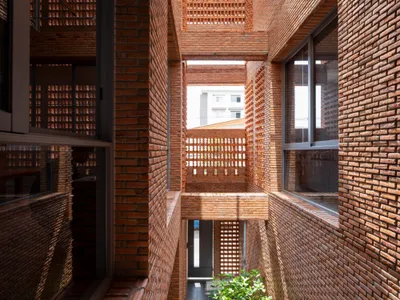 Studio Miti Wraps a Bangkok Family Home in Perforated Brick to Breathe Without Air Conditioning