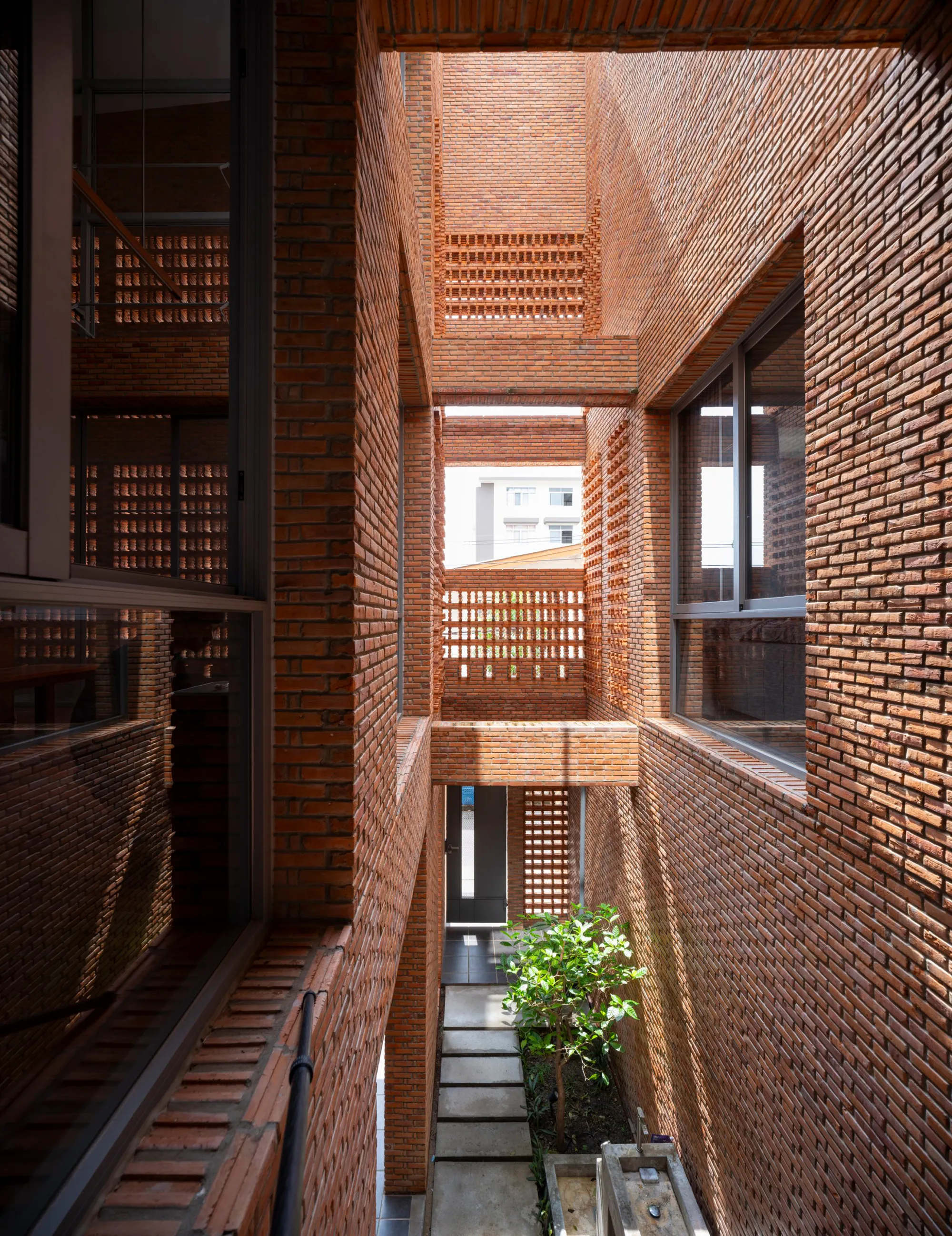 Studio Miti Wraps a Bangkok Family Home in Perforated Brick to Breathe Without Air Conditioning