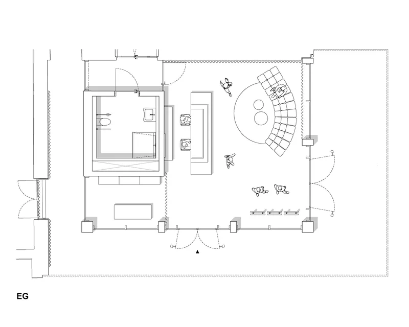Ground floor plan showing an amphitheater seating area, restrooms, and adjacent enclosed spaces