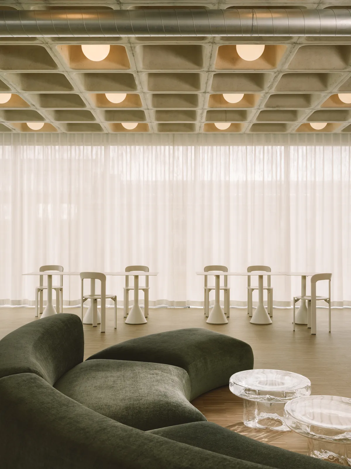 RHO Wraps a Berlin Social Media Agency in Concrete Waffle Ceilings and Sheer Light