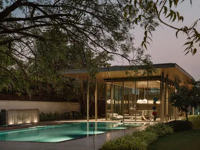 andblack design studio Folds a Concrete Roof Down to the Ground in an Ahmedabad Poolside Pavilion