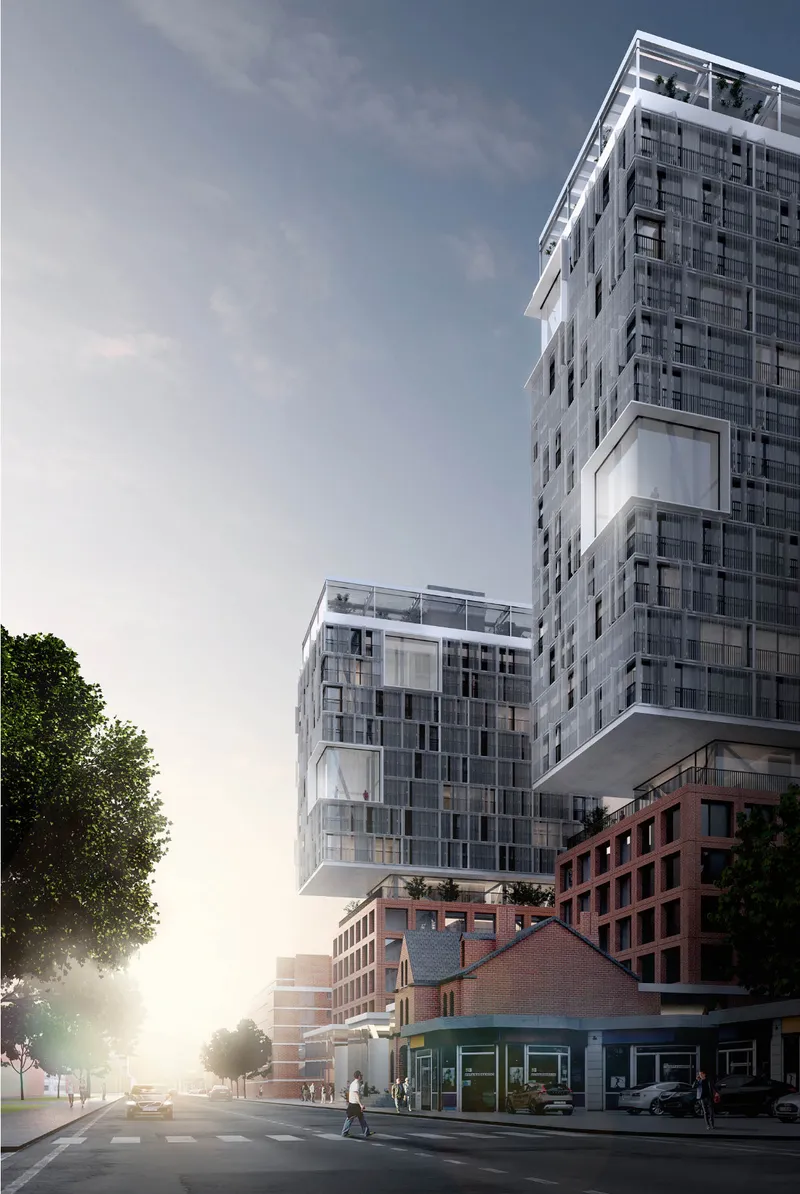 Street-level view showing the project’s raised residential volumes, heritage context, and active downtown frontage.