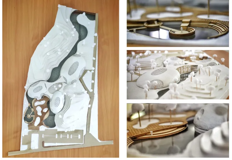 Physical site model highlighting flowing contours, water channels, bridges, and organic built forms.