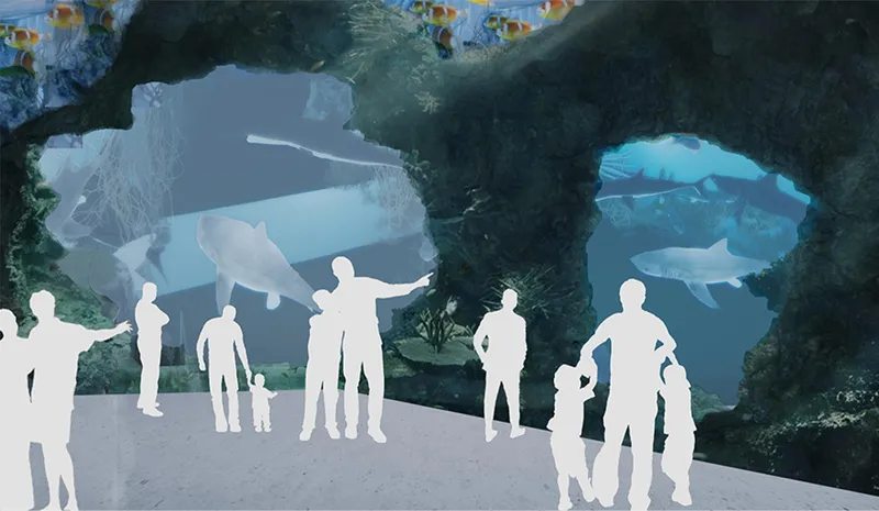Underwater tunnel experience where visitors walk beside marine life in an immersive aquatic environment.