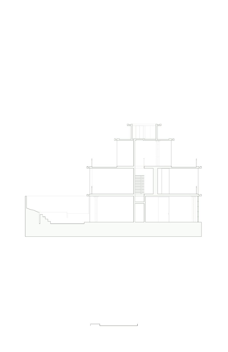 Section drawing showing a four-storey structure with central staircase and sloping ground condition