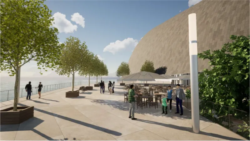 The waterfront terrace extends public life outdoors with dining, greenery, pedestrian space, and uninterrupted views toward the sea.