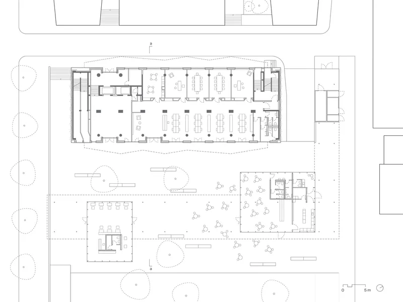 Ground floor plan drawing showing office layouts above and landscaped courtyard with pavilion below