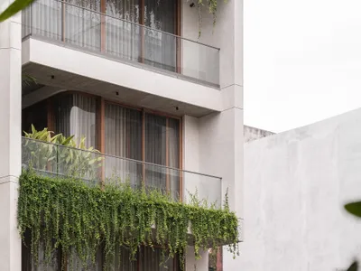 Neogenesis and Studi0261 Stack Balconies and Green Veils into a Layered Urban Home in Surat