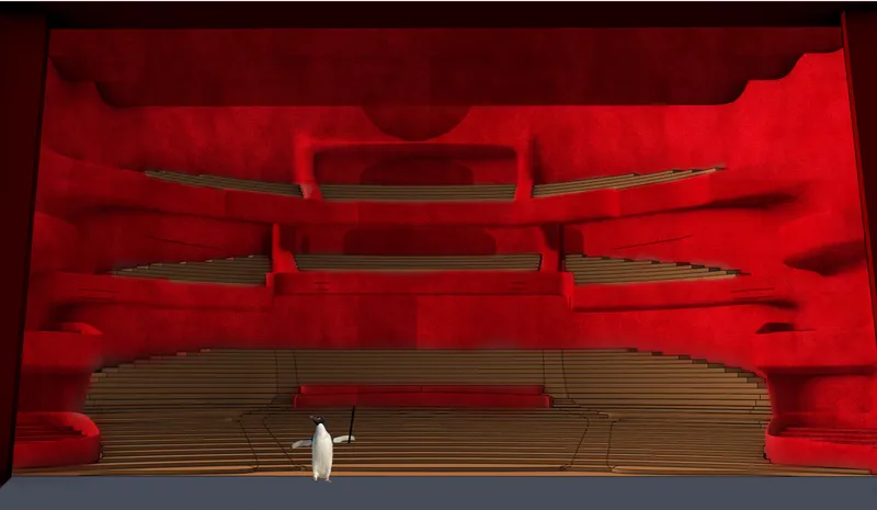 The main auditorium forms a dramatic red performance chamber with layered seating and balconies
