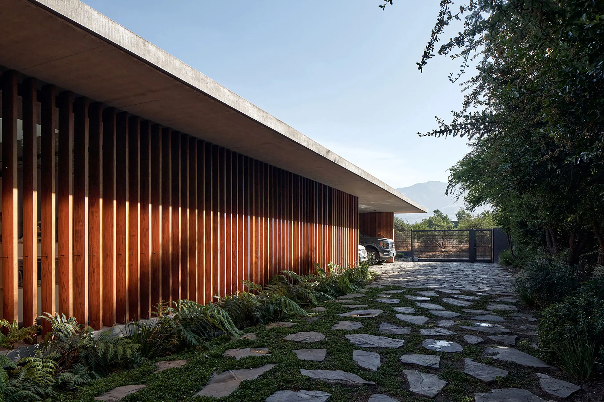 Juan Carlos Sabbagh Wraps a Chilean Suburban House in Timber Screens That Dissolve the Walls