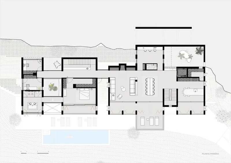 Floor plan drawing showing an elongated residence with swimming pool and landscaped surroundings