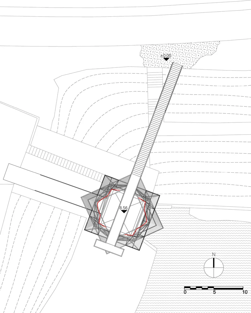 Site plan drawing showing the tower structure with internal circulation paths highlighted in red at the base