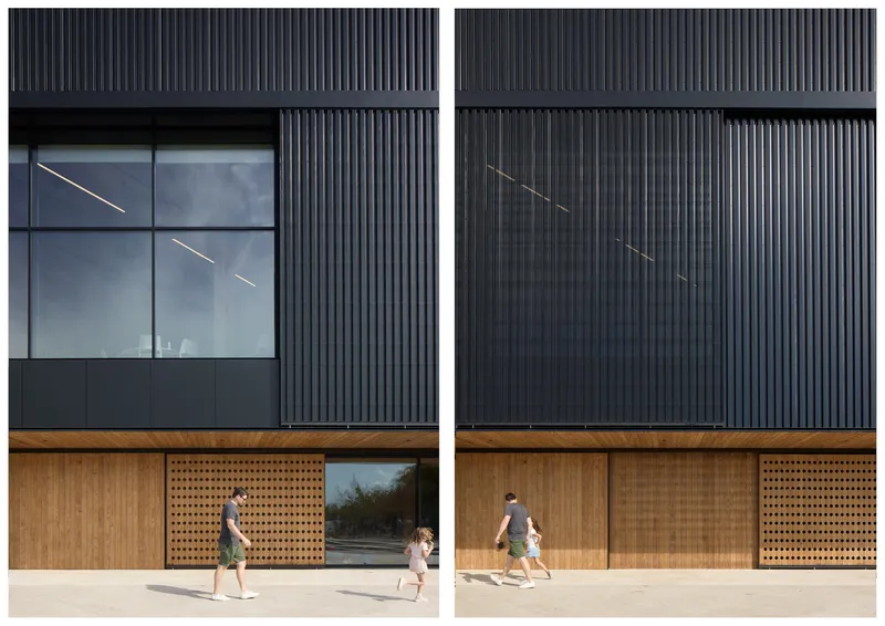 Facade detail showing vertical corrugated metal above timber screens and sliding glass doors with people passing below