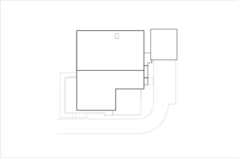 Site plan drawing showing interlocking rectangular volumes with a curved access road