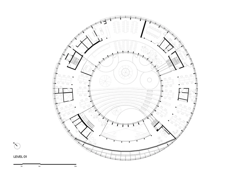 Floor plan drawing showing a circular layout with a central auditorium space surrounded by perimeter rooms