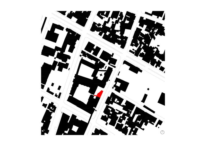 Site plan drawing showing the building highlighted in red among surrounding urban blocks and streets