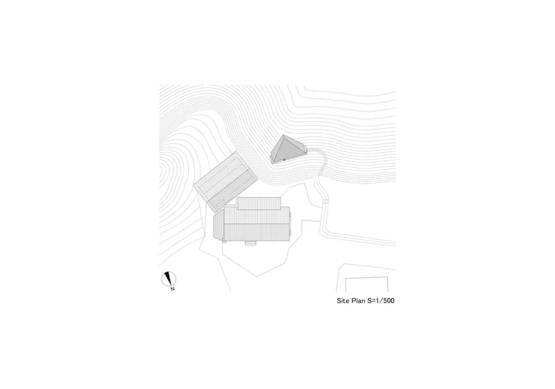 Site plan drawing showing buildings positioned among topographic contour lines and landscaping