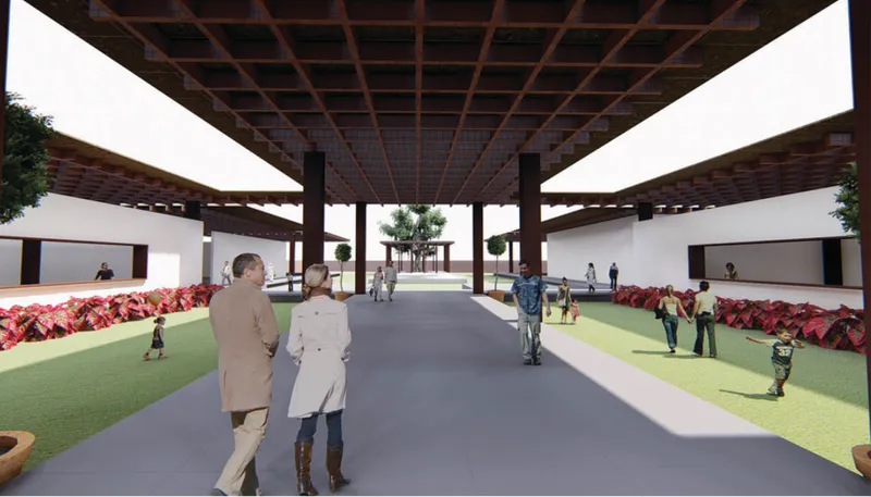 View through timber pergola with coffered ceiling showing planted beds and white walls flanking a central path
