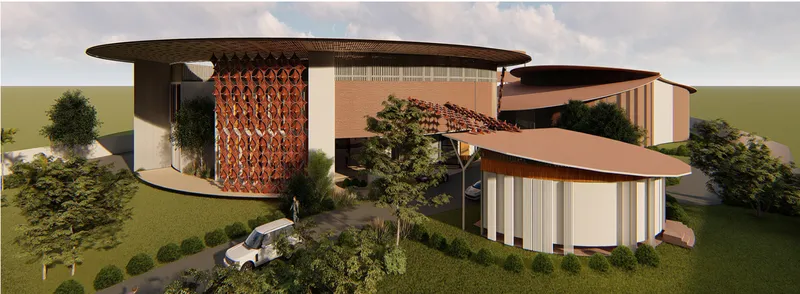 Aerial rendering showing curved roofs with copper screen tower and landscaped perimeter under cloudy skies