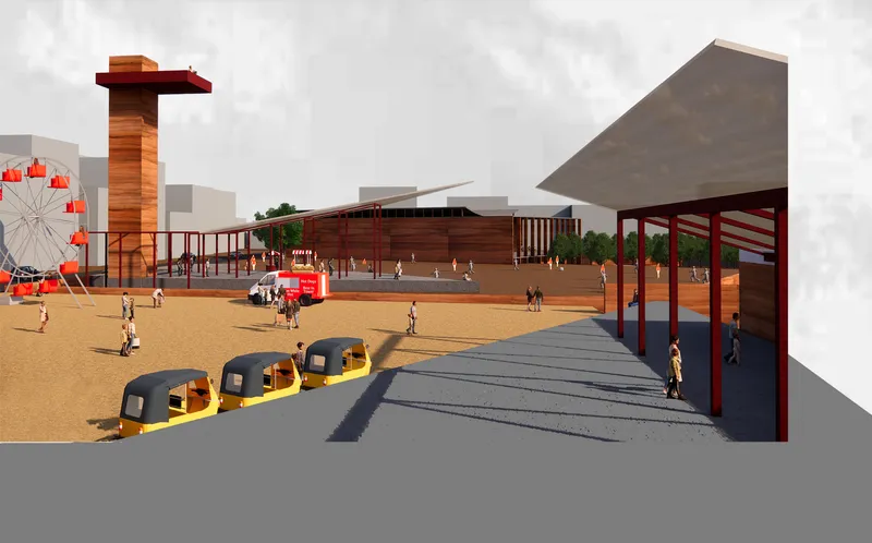 View across the open plaza showing the timber-clad buildings, red observation tower, and covered pavilion with people and vehicles