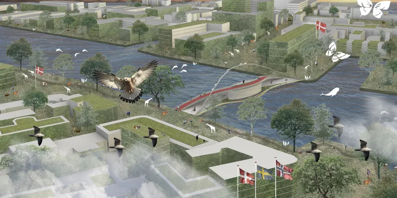 Aerial view of a pedestrian bridge with red railing spanning a river lined with trees and birds