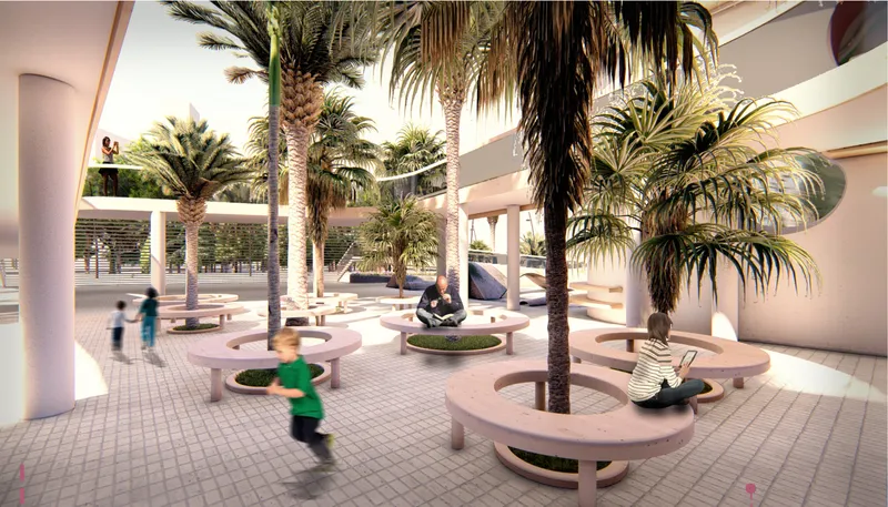 Semi-enclosed courtyard with circular planters containing palms and curved benches around tiled flooring