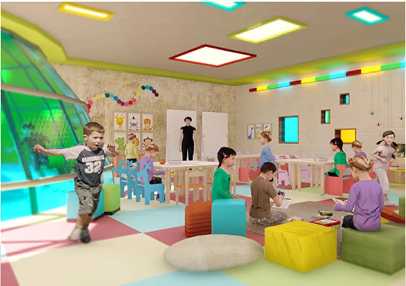 Play room interior with colored ceiling lights and floor cushions where children gather around tables