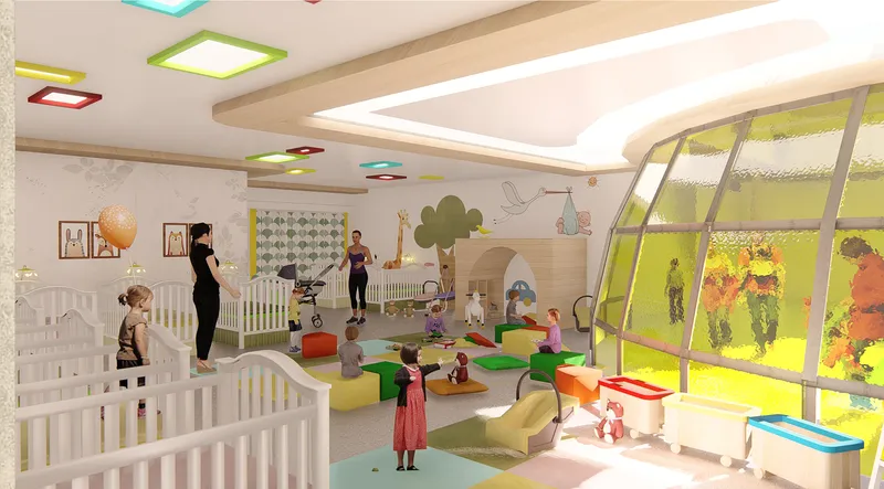 Nursery room with white cribs and angled windows overlooking a planted garden as staff attend to children