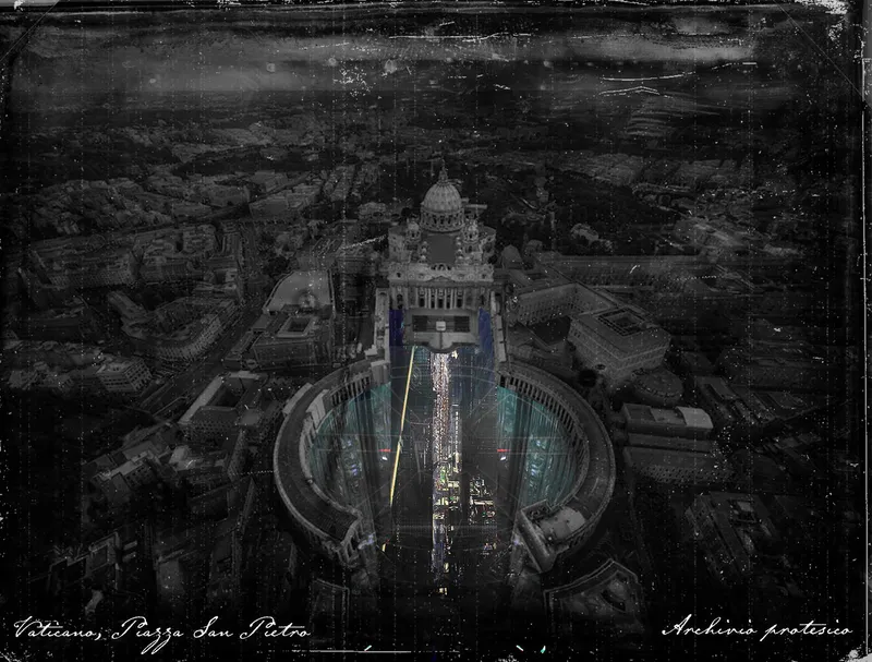 Aerial view of the oval colonnade and reflecting pool leading to a domed basilica at dusk