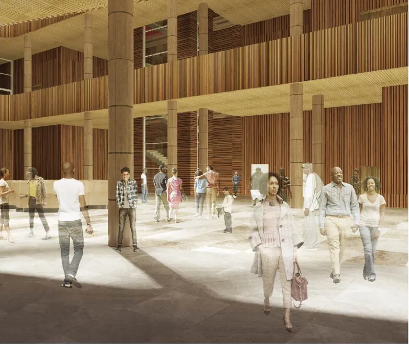 Interior lobby with vertical timber slat walls and concrete columns as visitors walk across polished floors