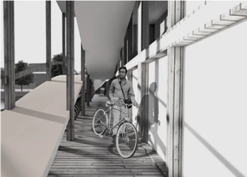 Covered timber walkway with glazed facade and cyclist casting shadow in afternoon sun