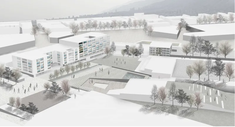 Aerial model view of a sunken courtyard surrounded by low volumes and bare winter trees