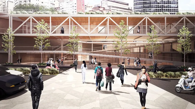 Street-level view of timber facade with diagonal white cross bracing and planted beds along the sidewalk