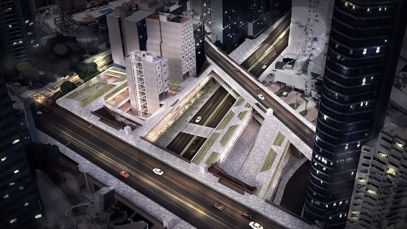 Aerial view at night showing the triangular roof opening and surrounding traffic on adjacent streets